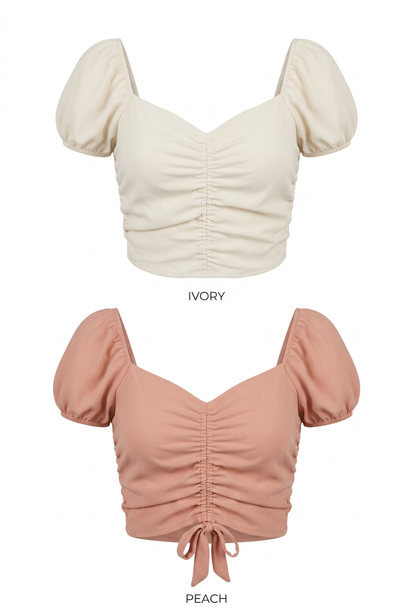 Ivory and peach ruched crop tops on a white background