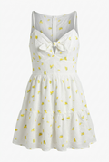 White dress with yellow floral patterns on a white background