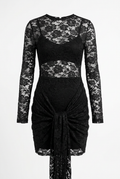 A black lace long-sleeve dress with a sheer floral lace bodice, a ruched waist, and a draped tie-front hem, shown against a plain white background.