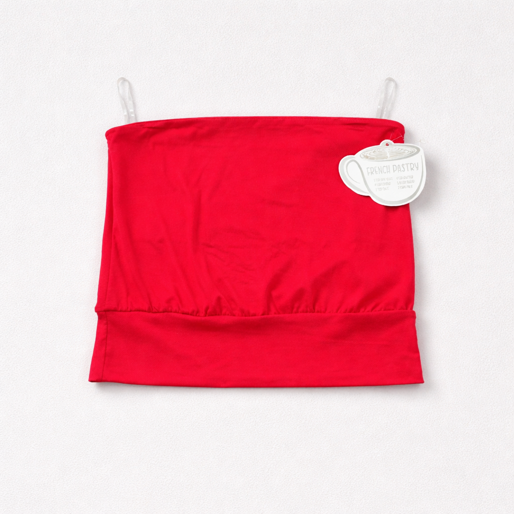 Red strapless top with a tag on a white background