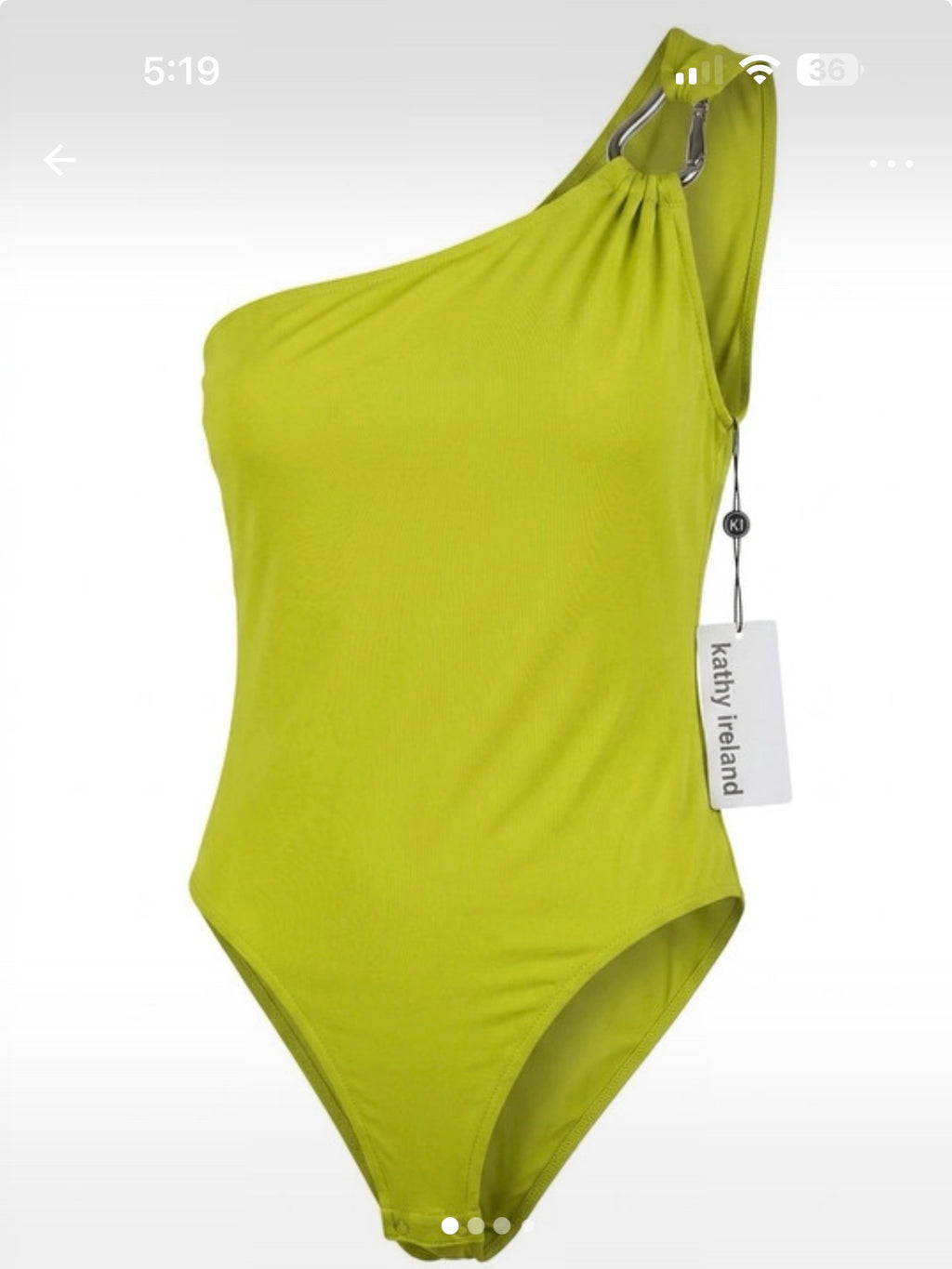 Green one-shoulder swimsuit with a tag on a white background