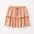Pink tiered skirt on a light gray background