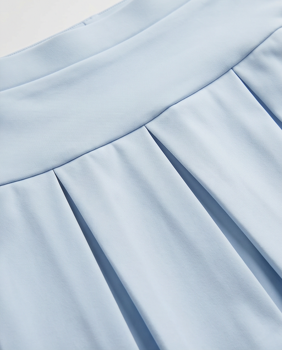 Close-up of light blue fabric with pleated texture