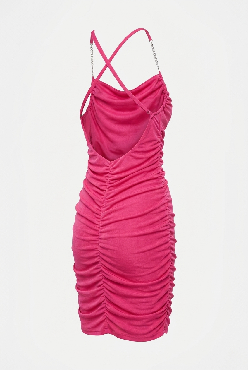 Pink ruched dress with thin straps on a light gray background