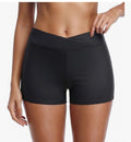 Black athletic shorts worn by a person on a white background