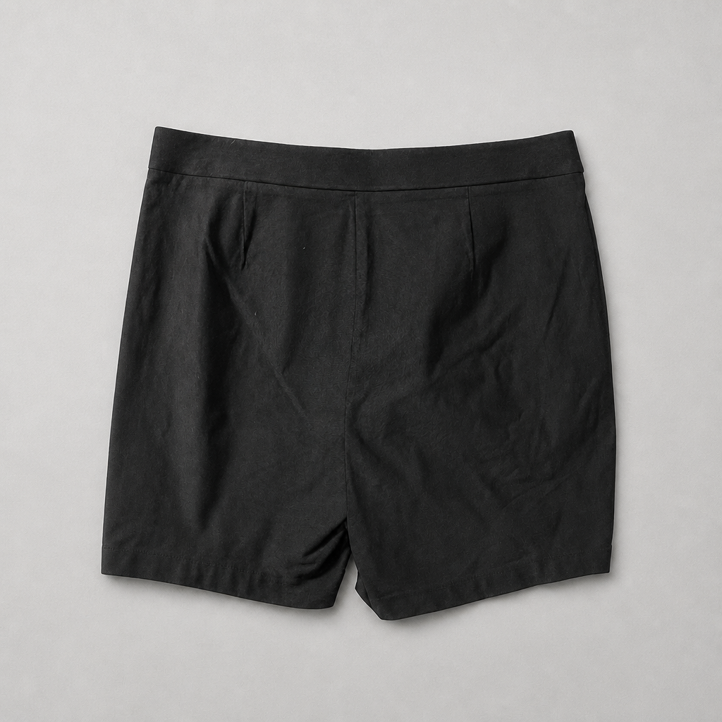 Back view — "Rafaella Women's black Bermuda shorts, back view showing clean stretch waistband and tailored fit"