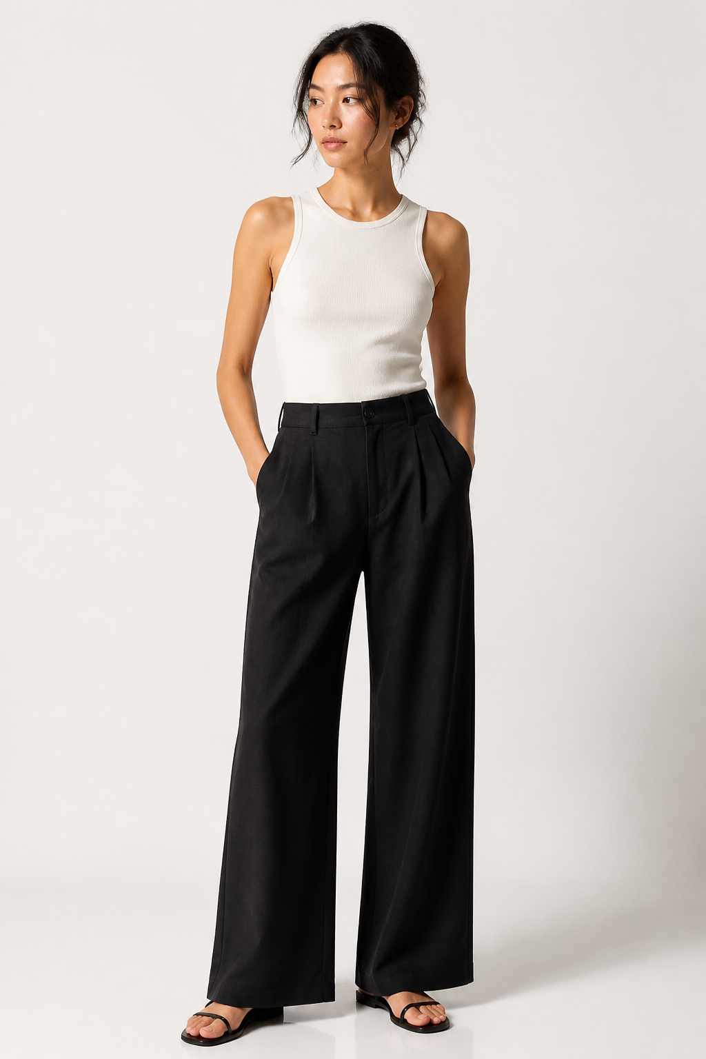 Willit women's black wide-leg linen-cotton trousers – full-length front view on model styled with white sleeveless top and sandals"