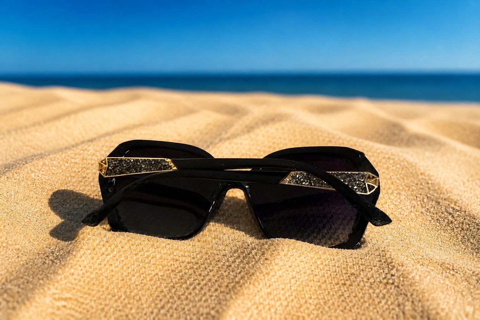 Oversized black sunglasses with crystal-embellished edges – side view"