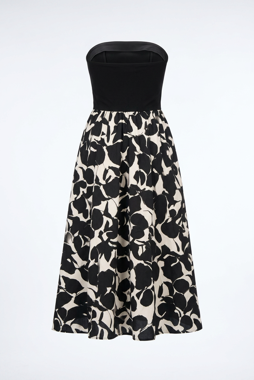 Black strapless top with a floral patterned skirt on a white background