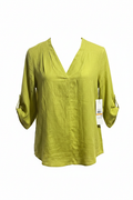 Green blouse with a tag on a white background