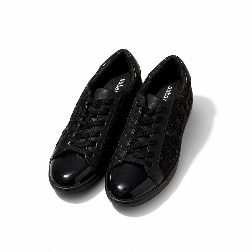 Pair of black sneakers on a white background