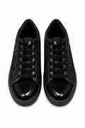 Pair of black sneakers on a white background