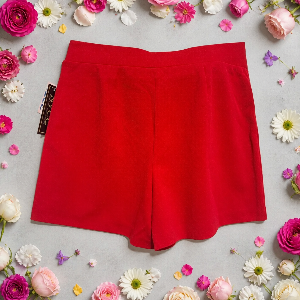 Red shorts on a gray background with flowers around