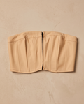 Beige strapless top on a beige background